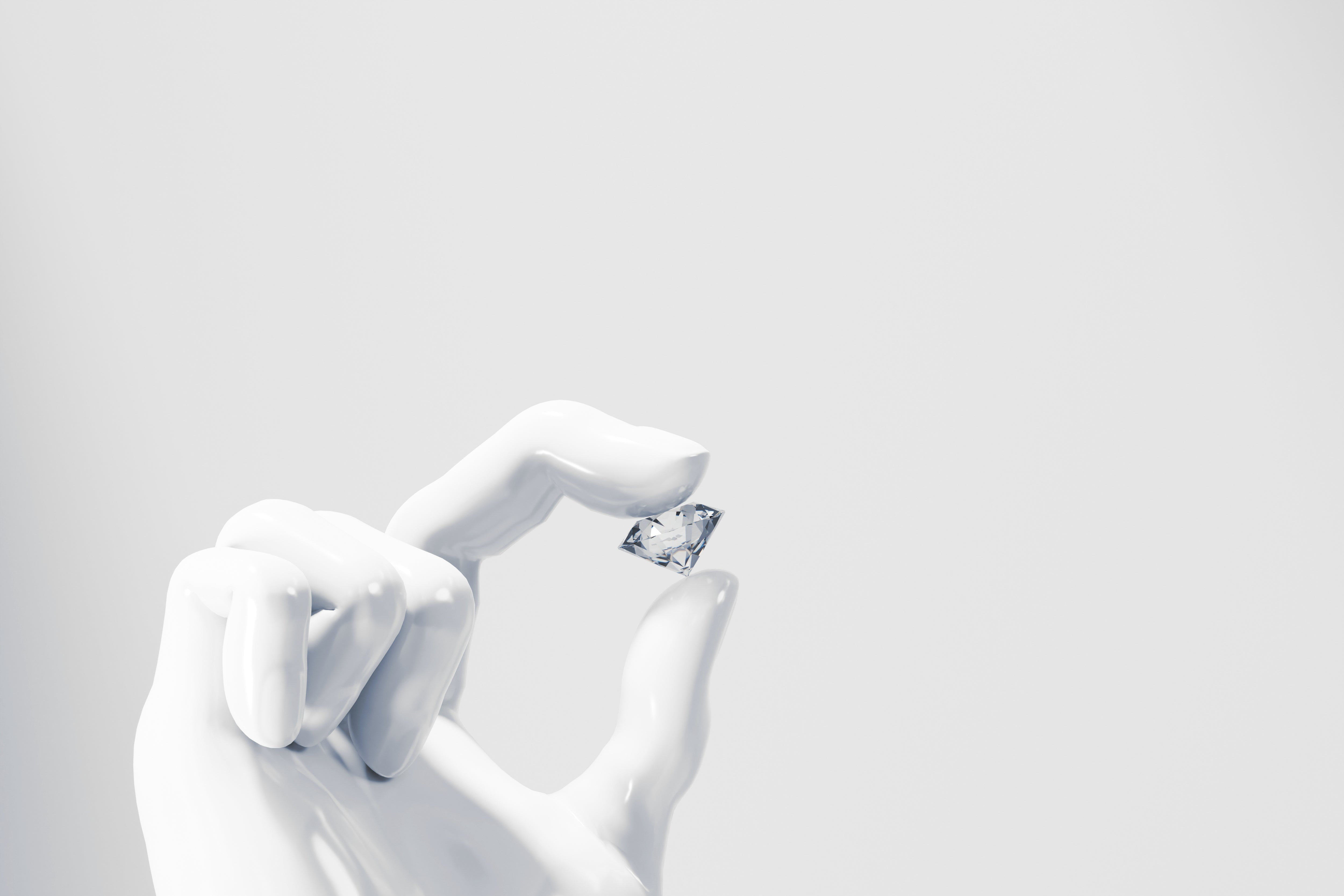 hand sculpture holding a diamond 鑽石